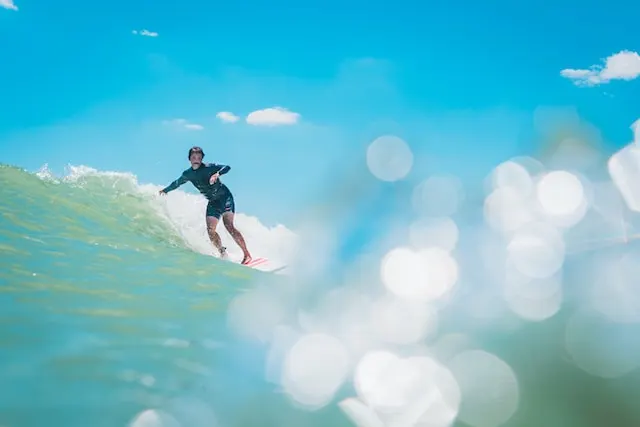 person surfing on wave during daytime